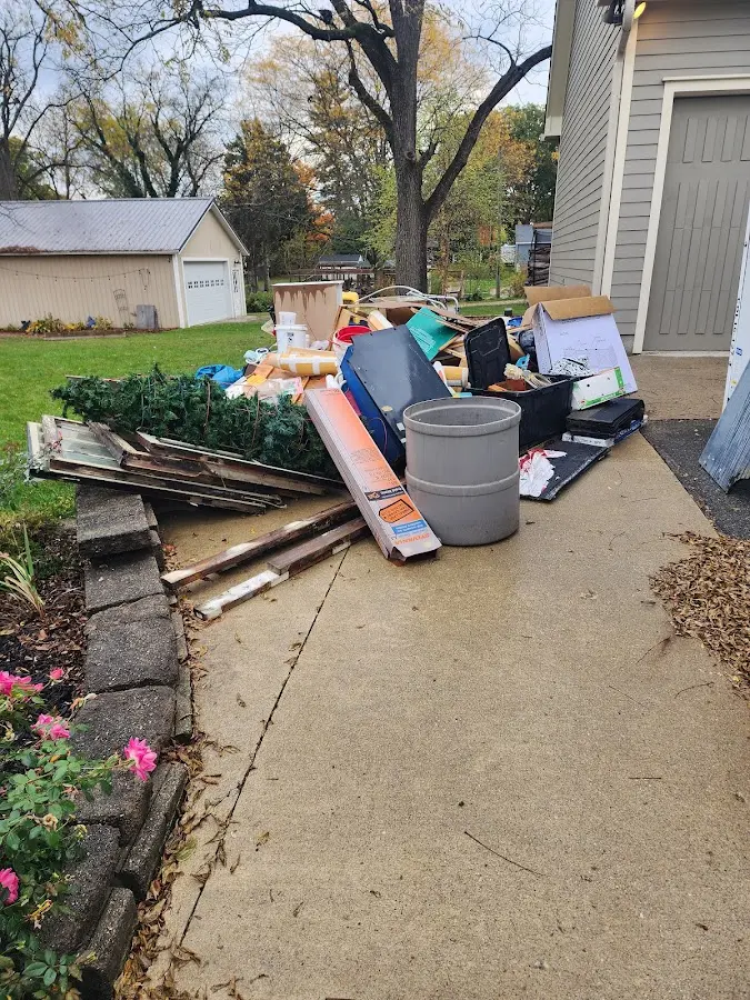 Dumpster being loaded with debris for 30 Yard Dumpster Rental in East Bridgewater